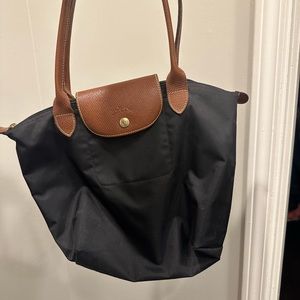 Great bag. Still has life left! See pictures, corners of bag are worn.